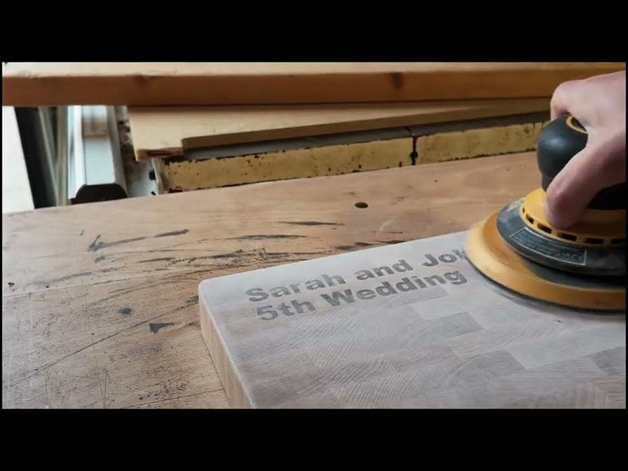 Sanding a personalised end-grain maple chopping board in the Cloumann workshop